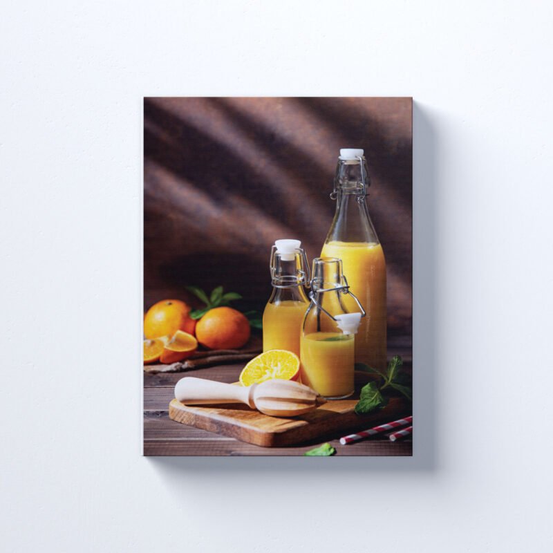 Orange juice in three bottles with citrus fruits on cutting board Canvas Wall Art - Image 2